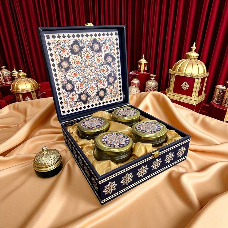 Four jars arranged in a decorative presentation box